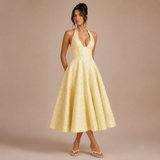 Ángela - Rochie midi halter cu fundă și fustă voluminoasă.